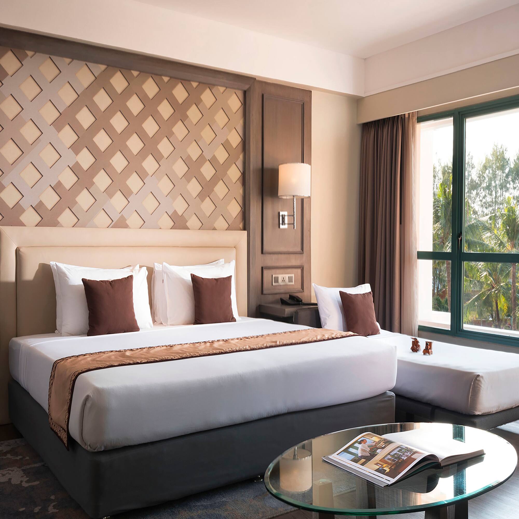 a bedroom with a bed and a glass table