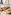a shelf with bowls of food and cups