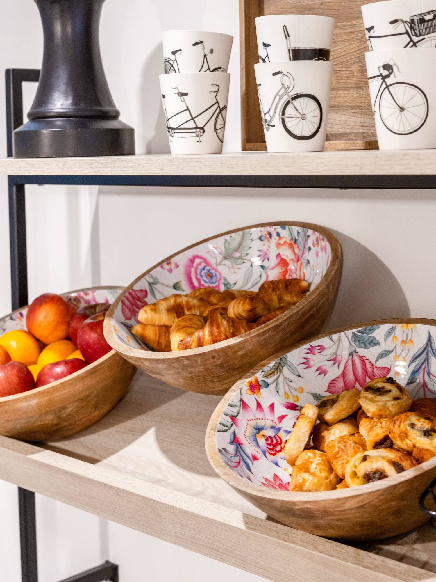 a shelf with bowls of food and cups
