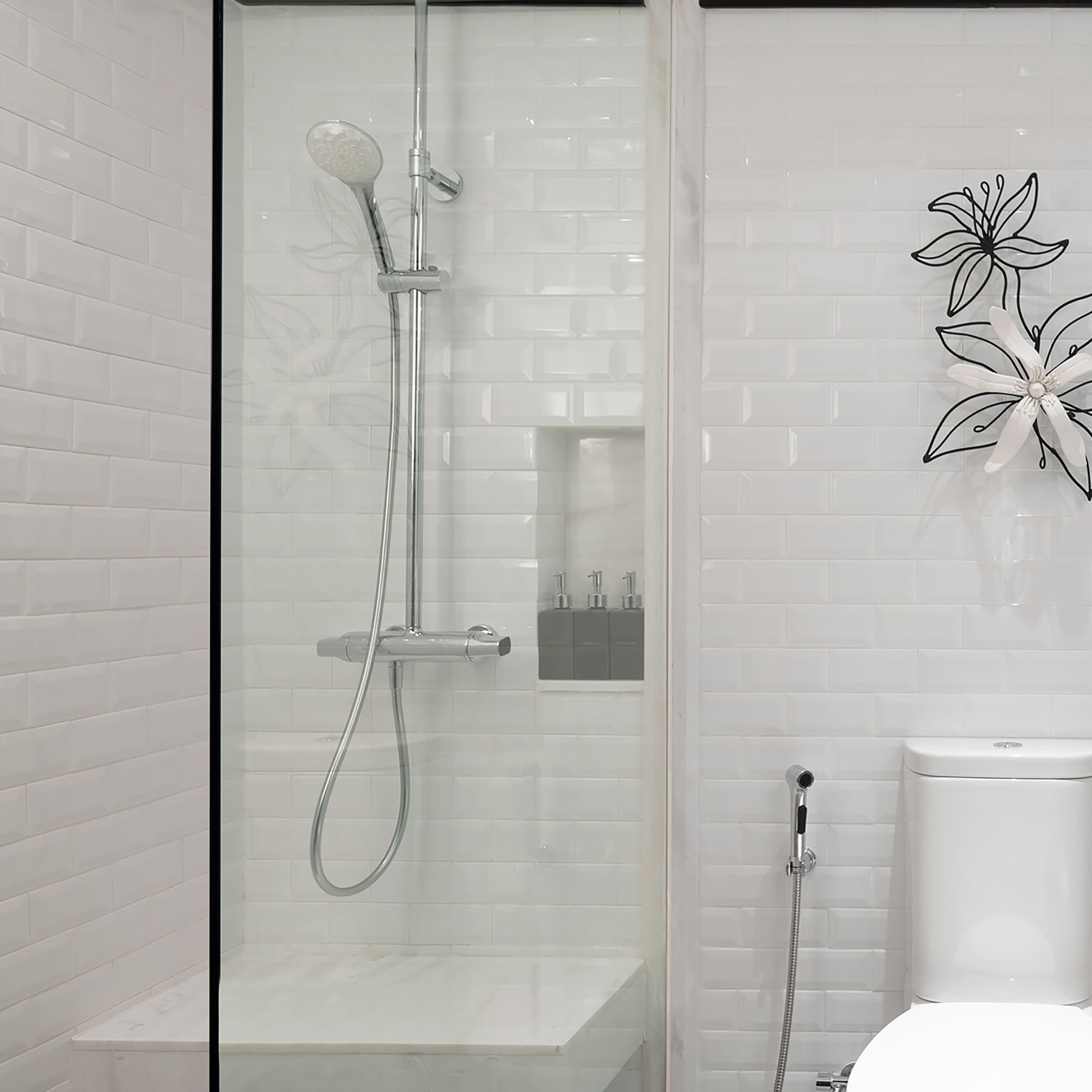 a shower with a toilet and a toilet