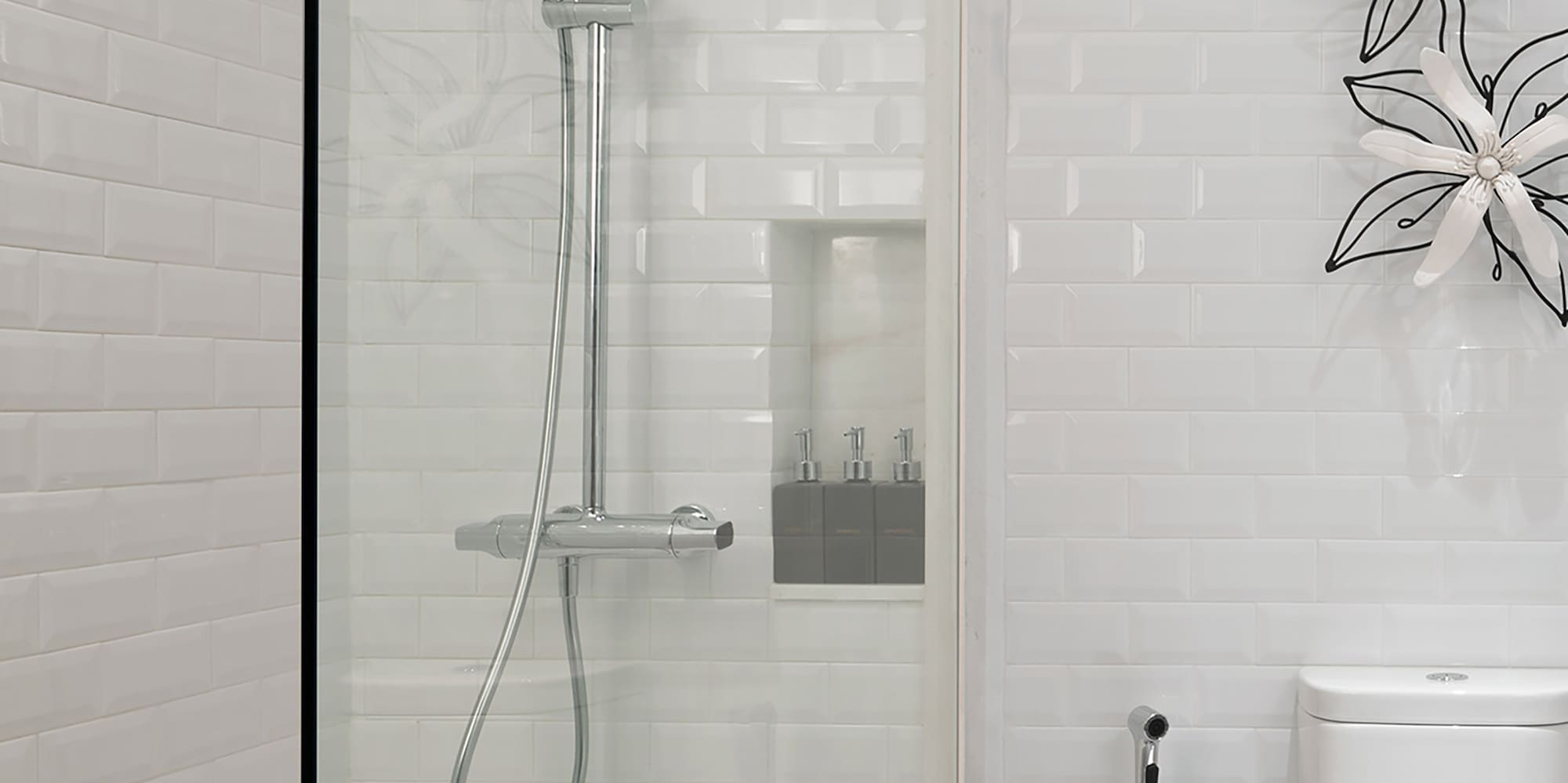 a shower with a toilet and a toilet