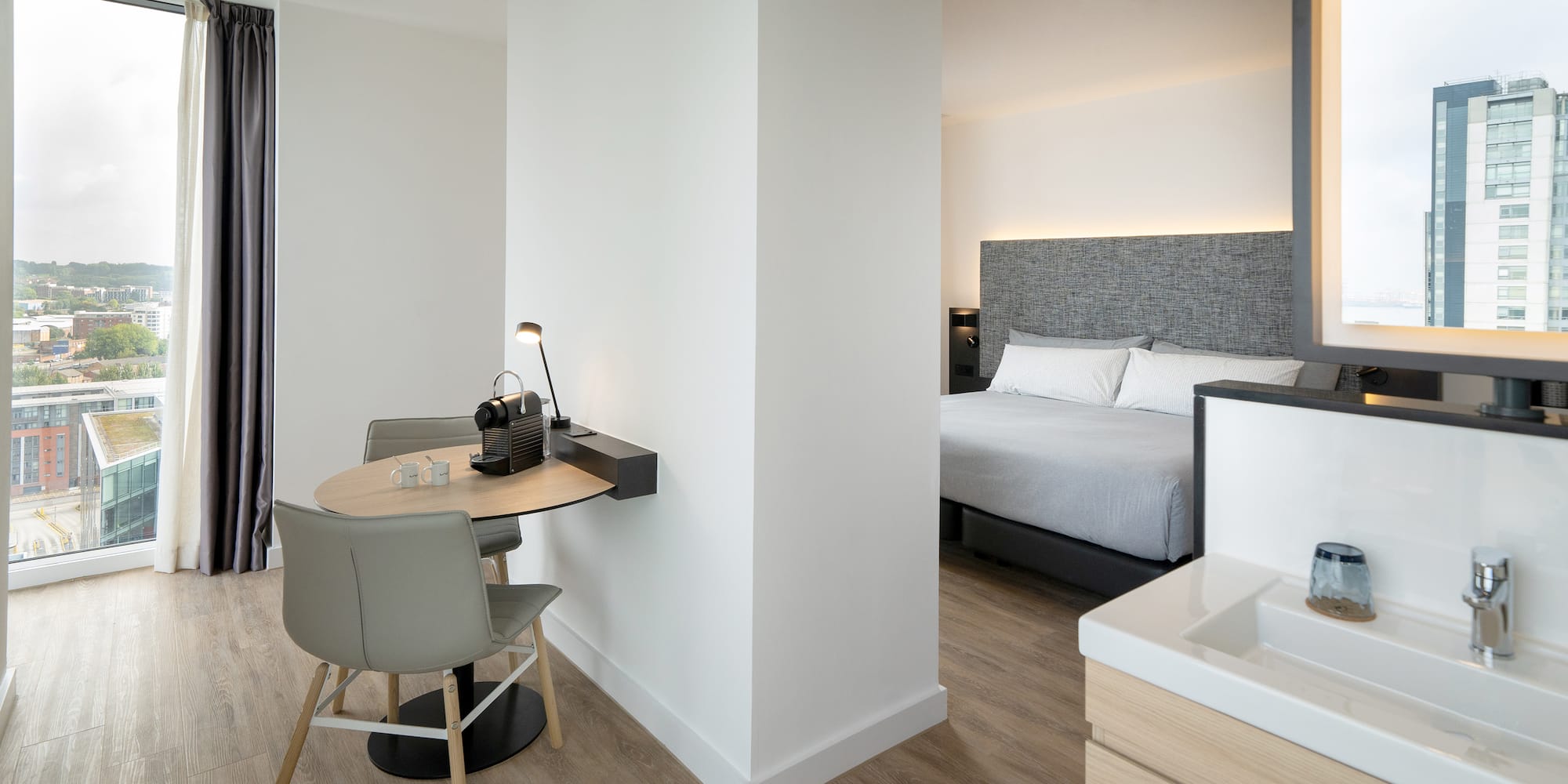 a room with a bed and a desk