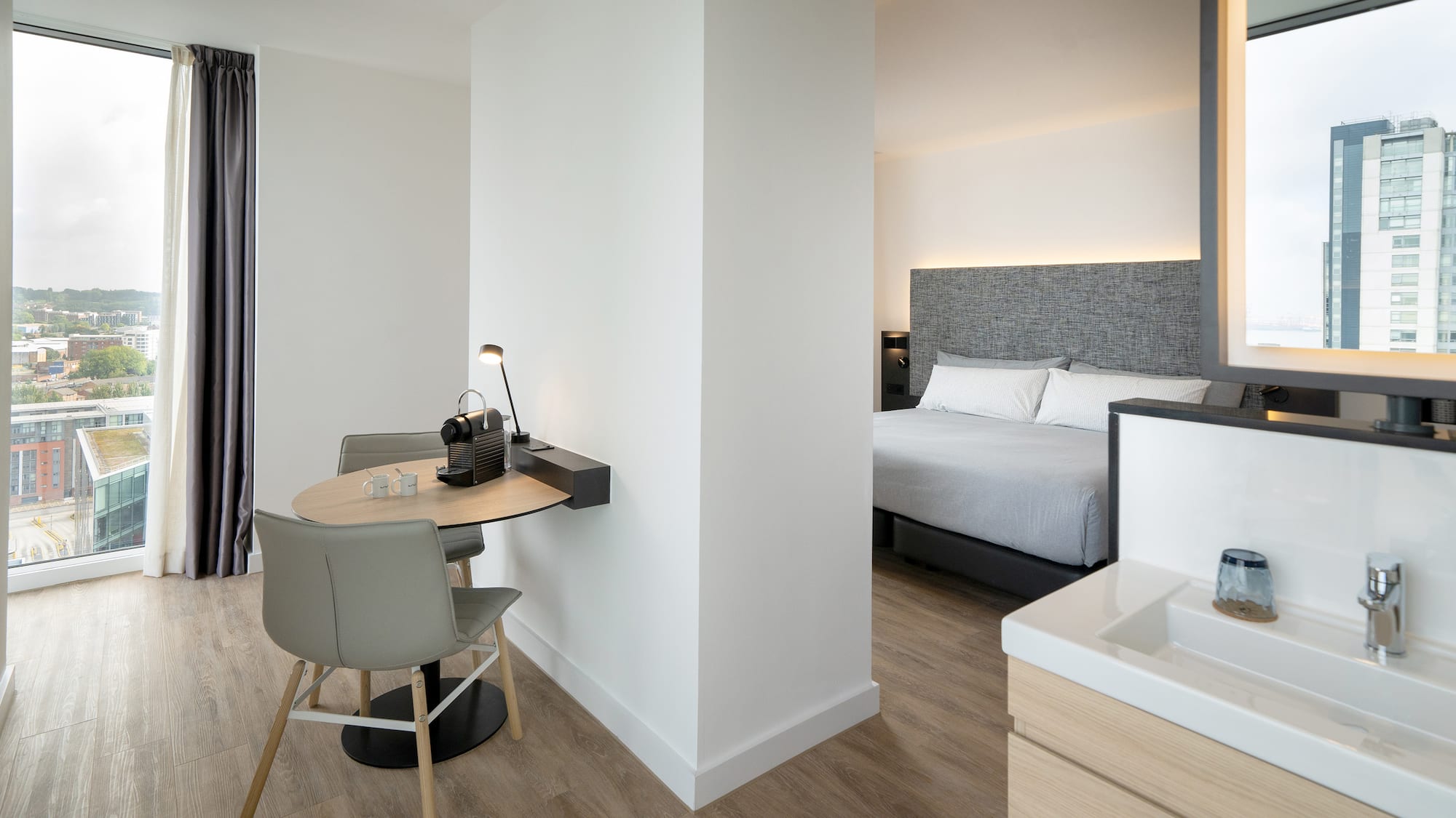 a room with a bed and a desk