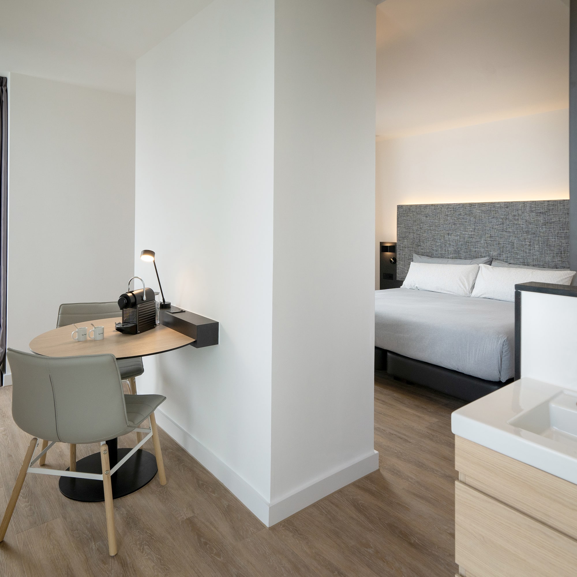 a room with a bed and a desk