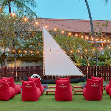 a group of red bean bags in a yard