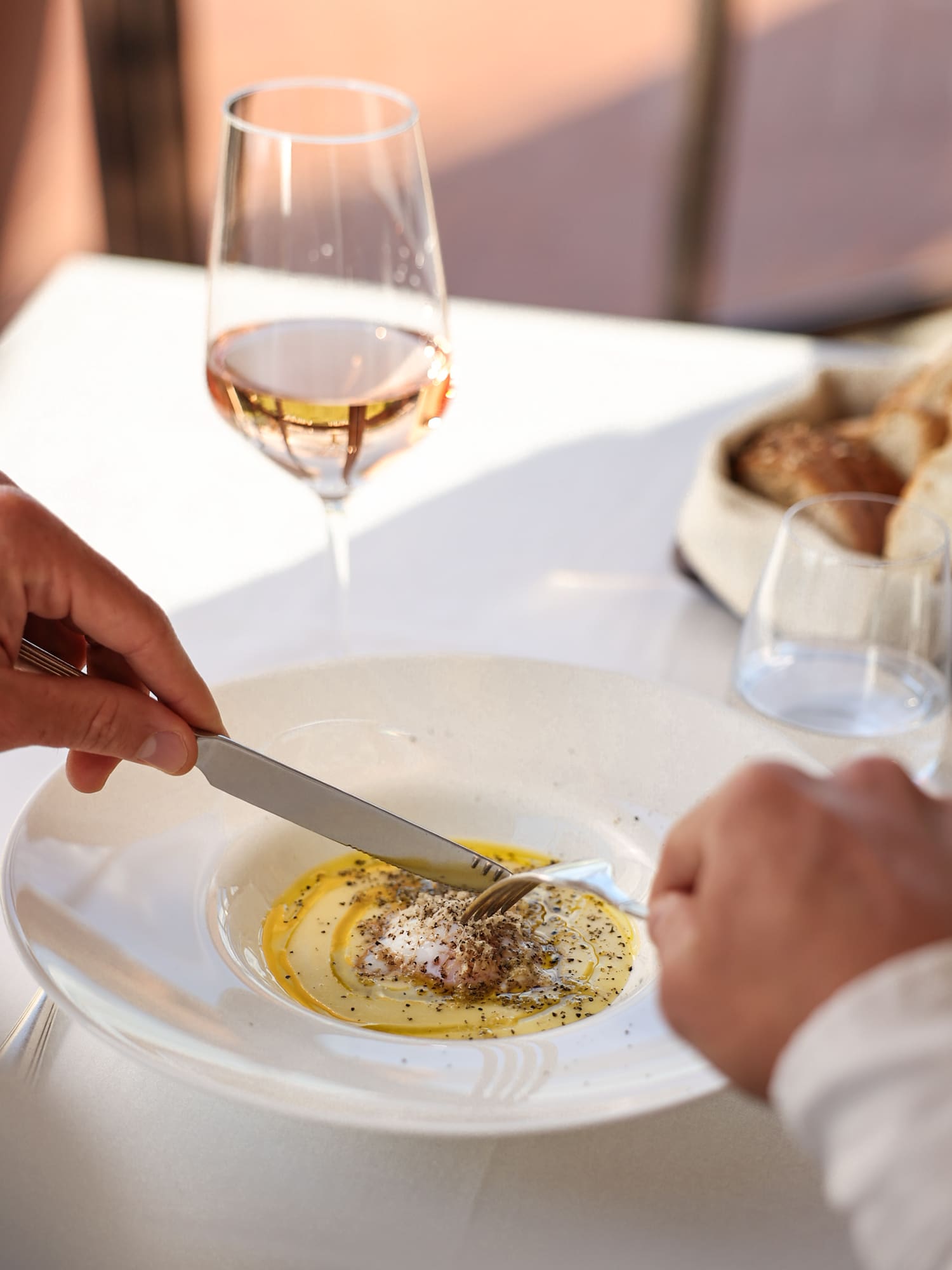 a person eating food on a plate