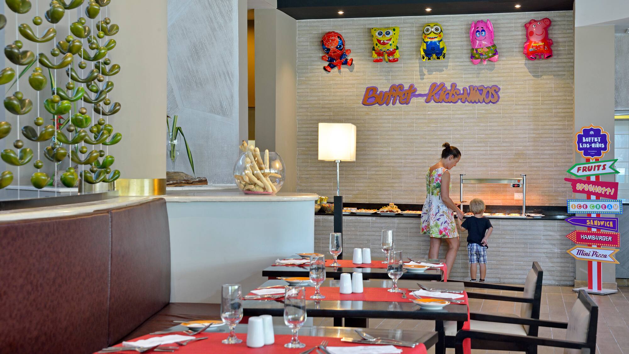 a woman and a child in a restaurant