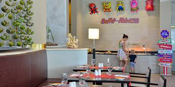 a woman and a child in a restaurant