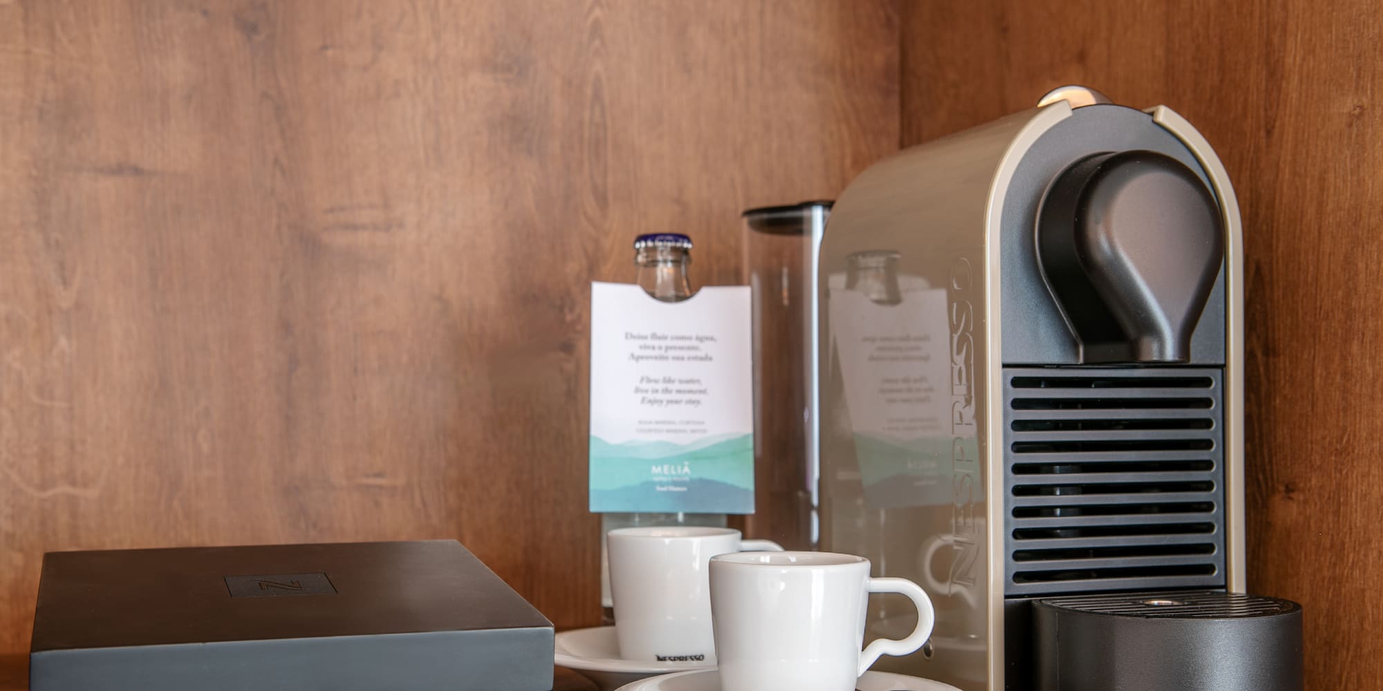a coffee machine and coffee cups on a table