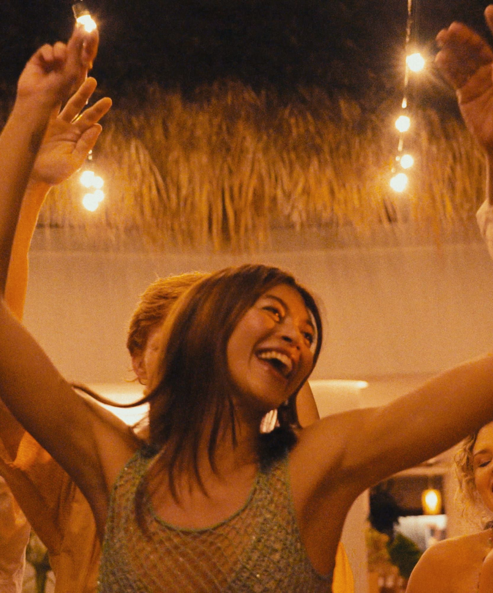 a group of people dancing at a party