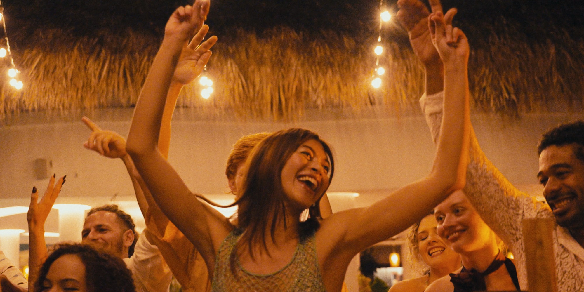 a group of people dancing at a party