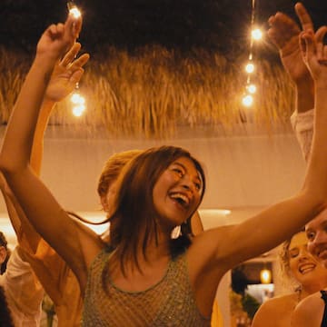 a group of people dancing at a party