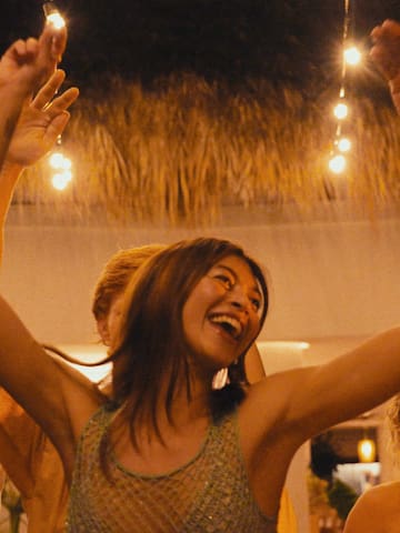 a group of people dancing at a party