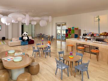 a room with a large table and chairs