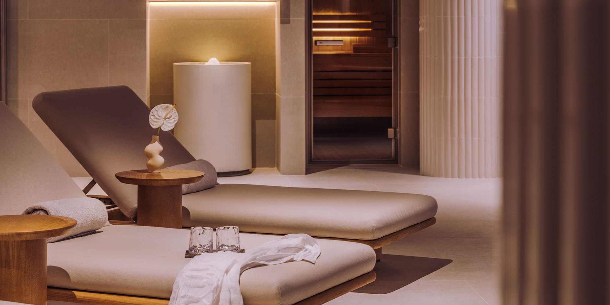 a room with chairs and a sauna