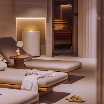 a room with chairs and a sauna