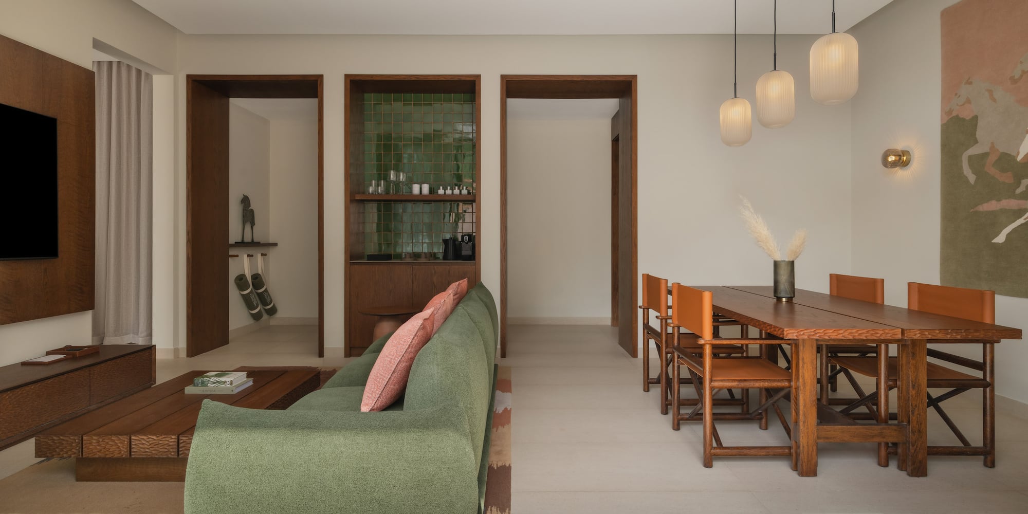 a living room with a green couch and a table