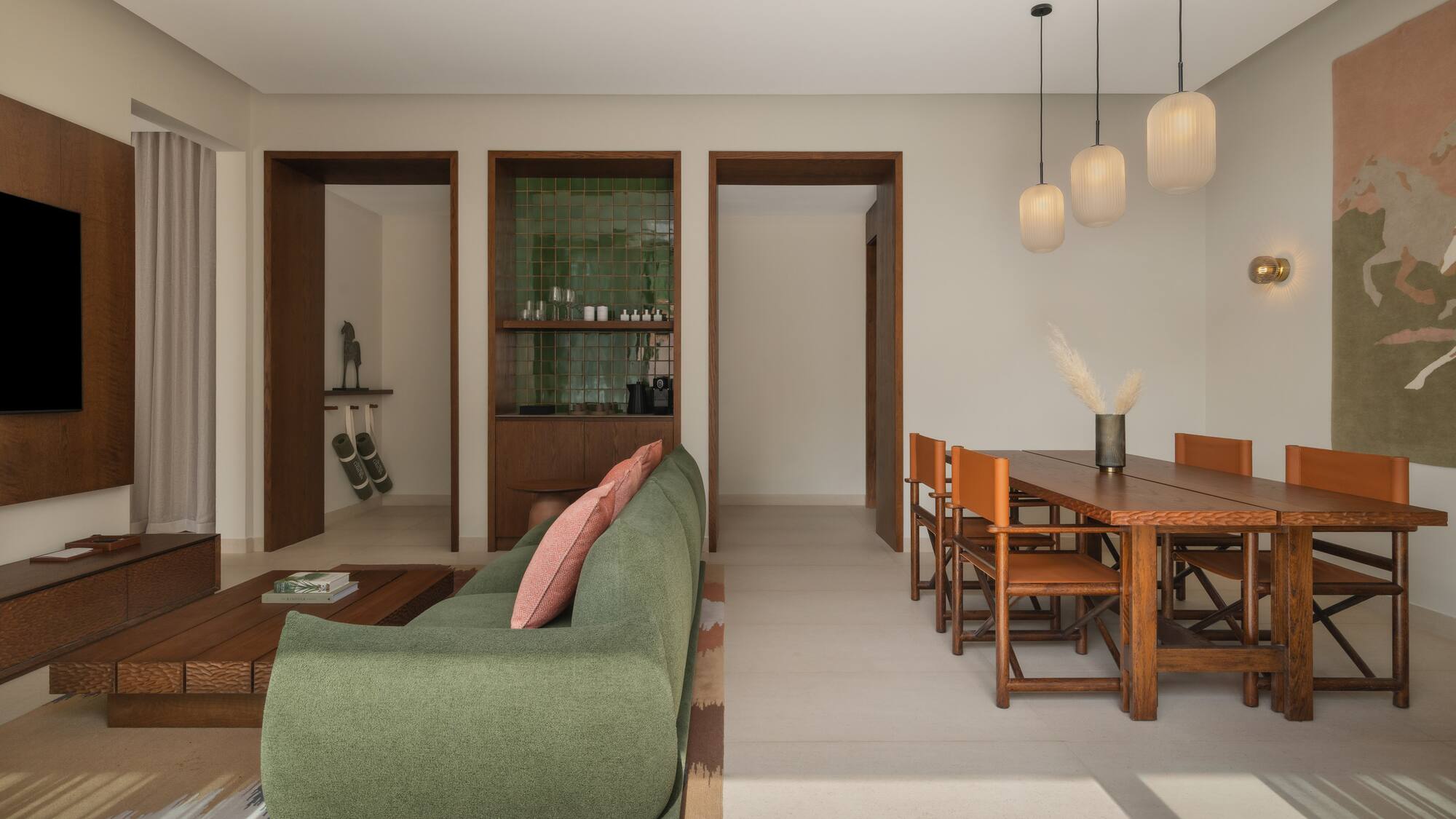 a living room with a green couch and a table