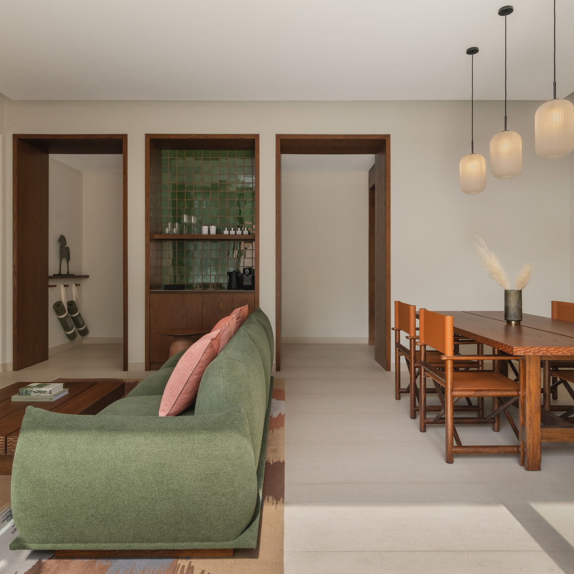 a living room with a green couch and a table
