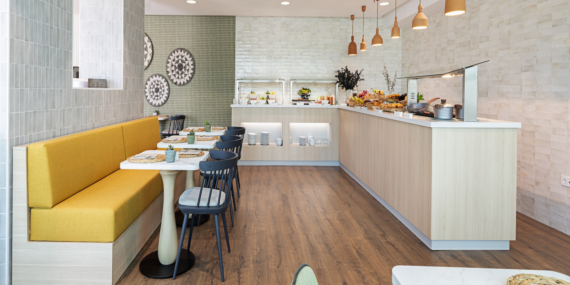 a restaurant with a yellow booth and yellow bench
