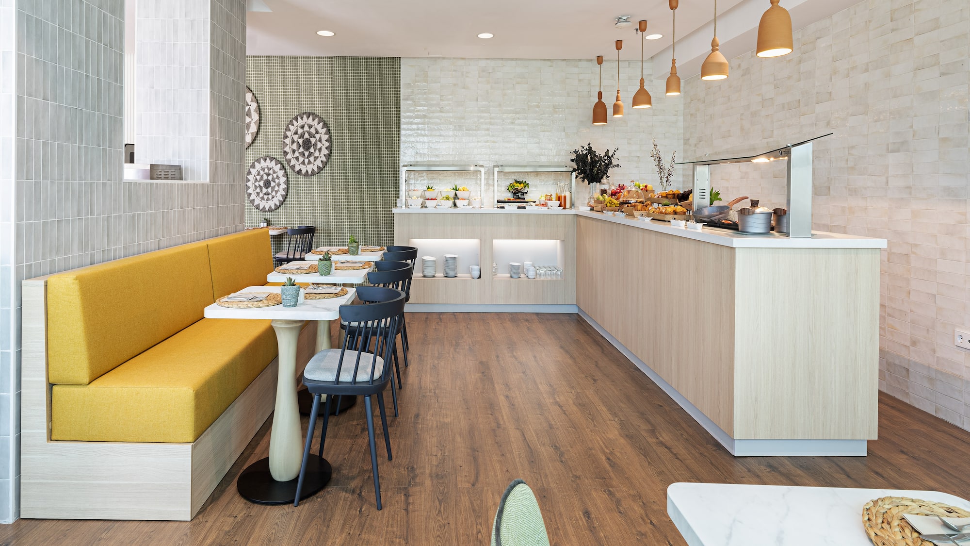a restaurant with a yellow booth and yellow bench
