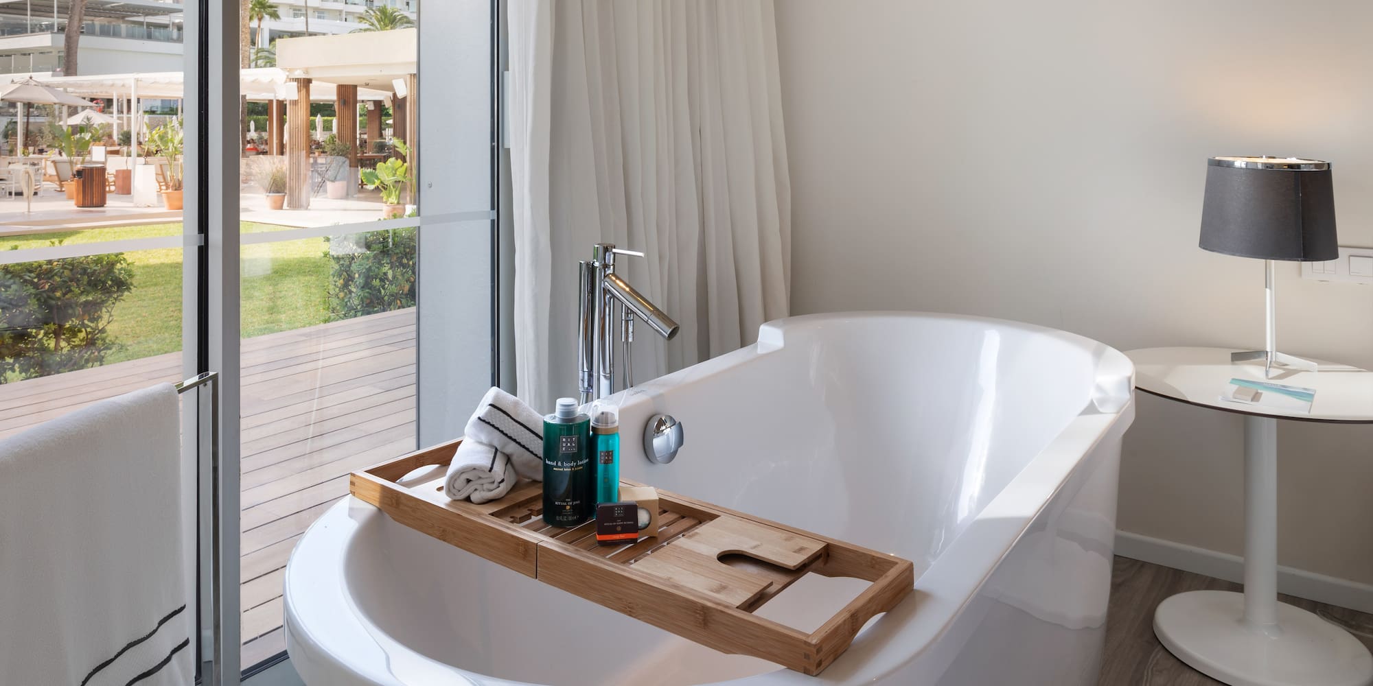 a bathtub with a tray on it