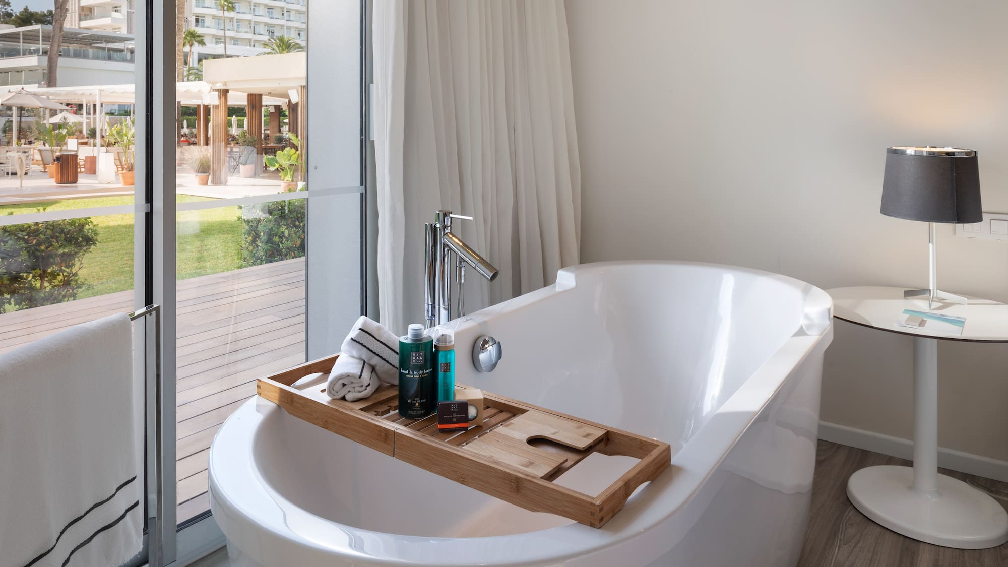 a bathtub with a tray on it