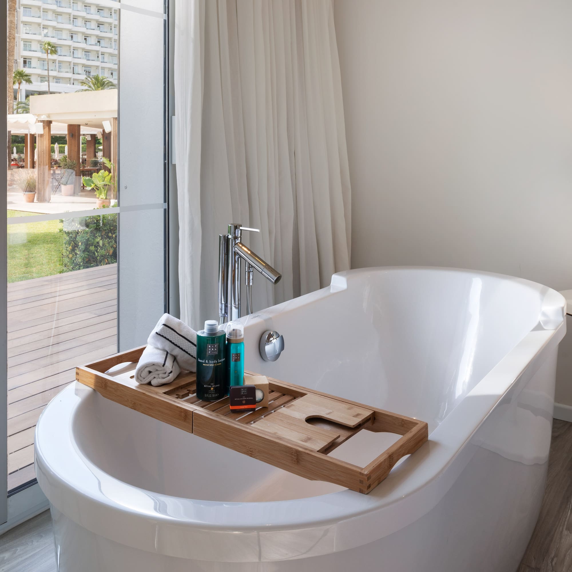 a bathtub with a tray on it