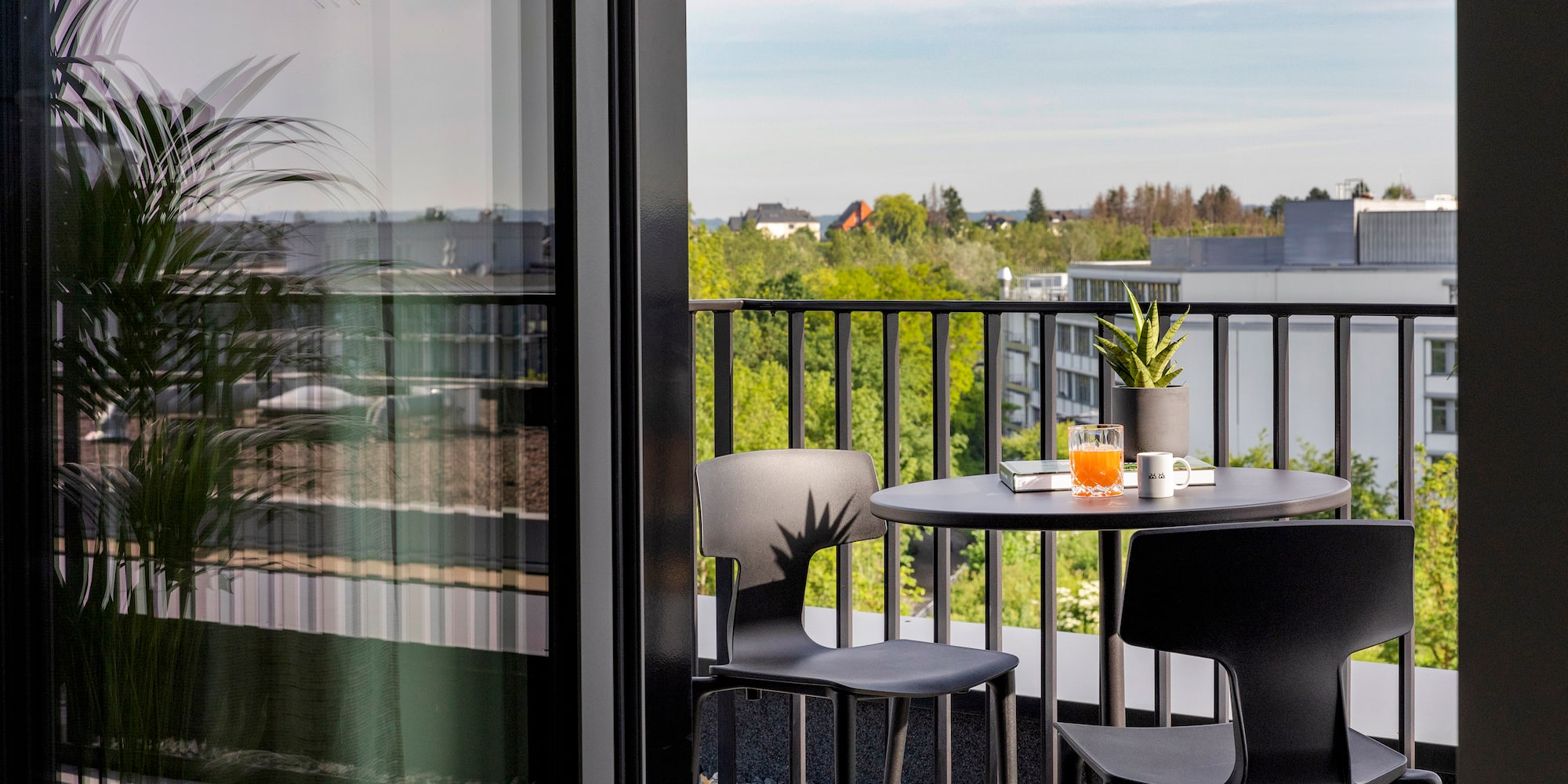 a table and chairs on a balcony