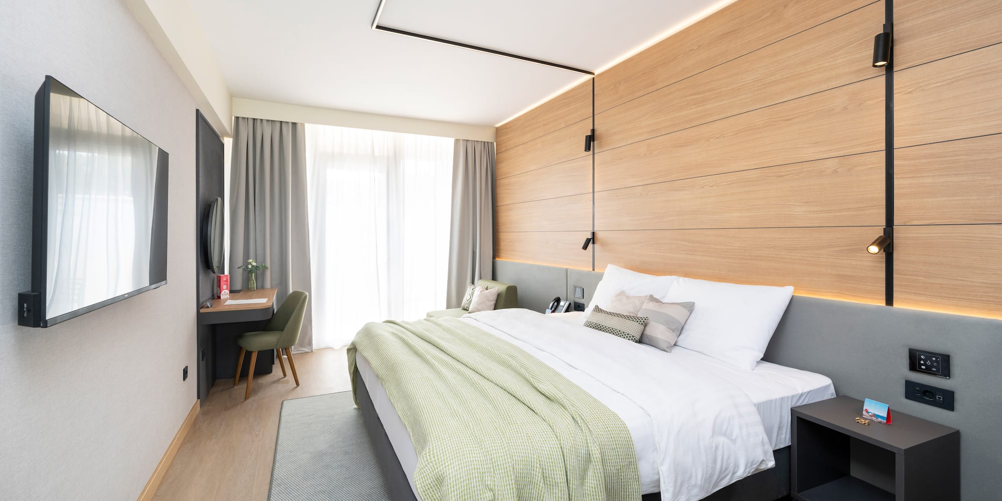 a bedroom with a bed and a desk