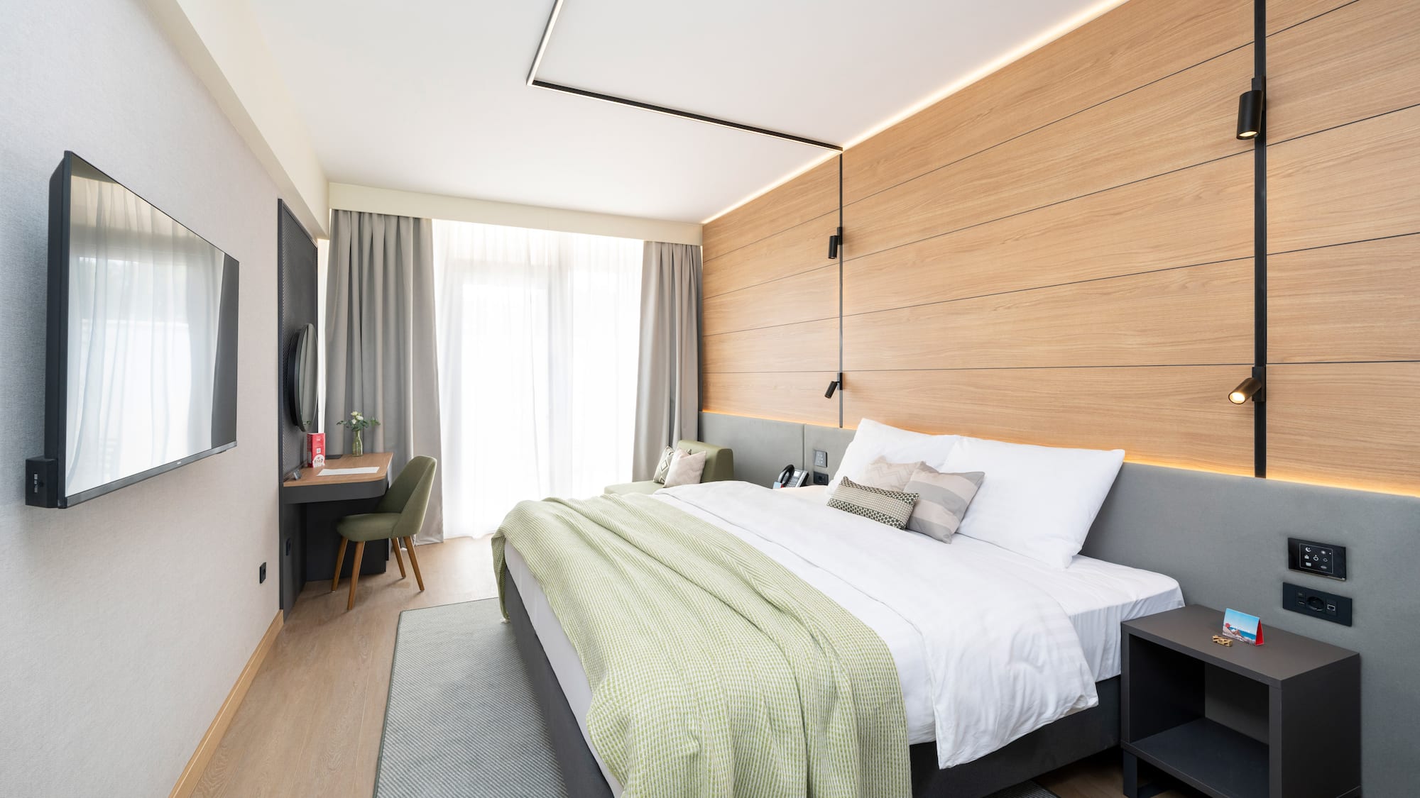 a bedroom with a bed and a desk