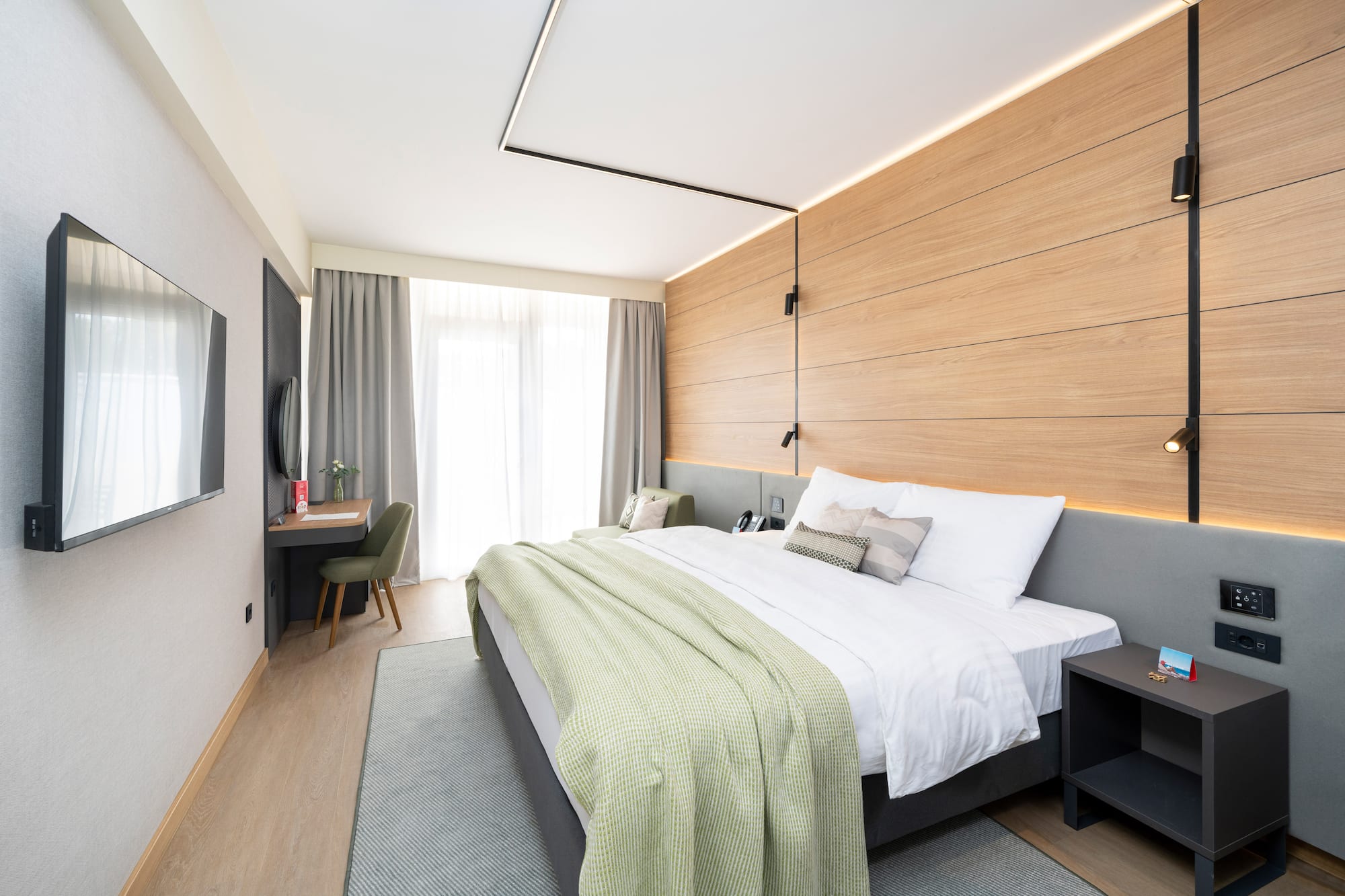 a bedroom with a bed and a desk