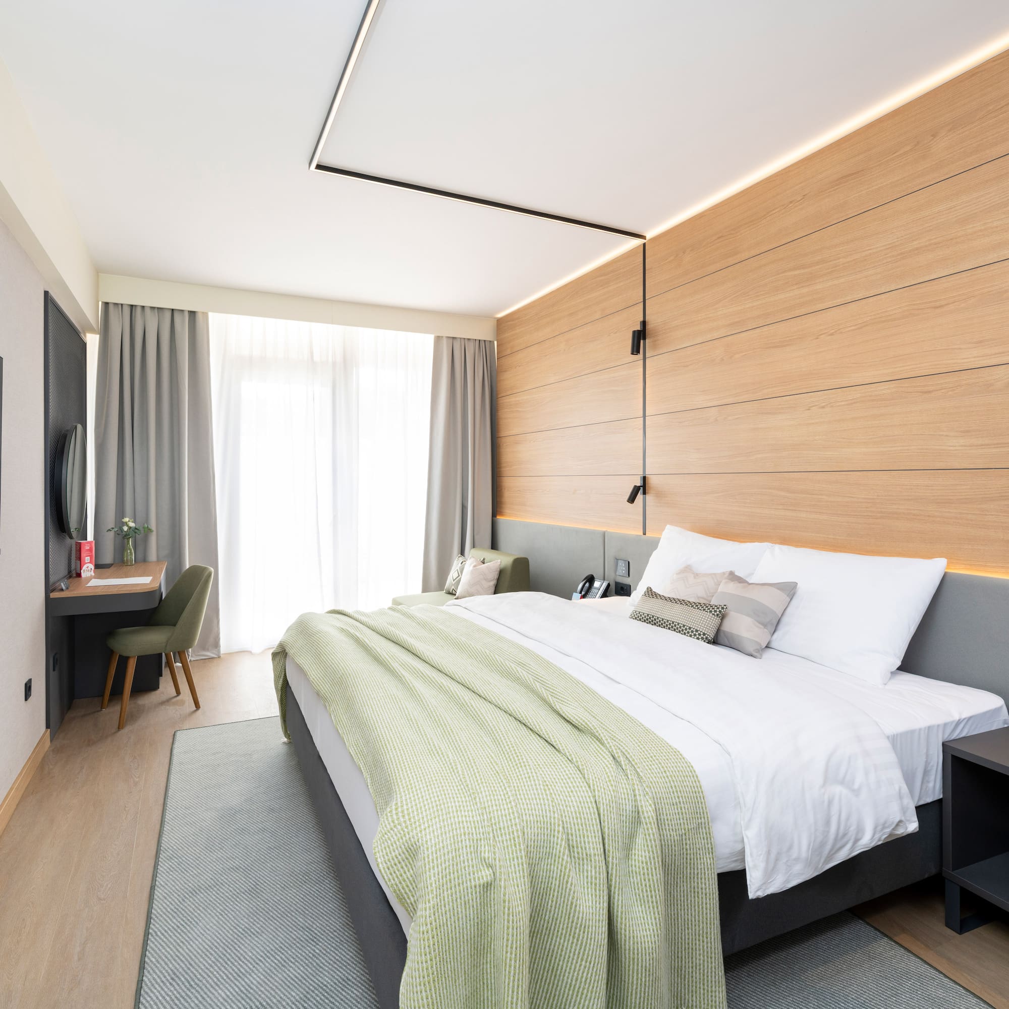 a bedroom with a bed and a desk