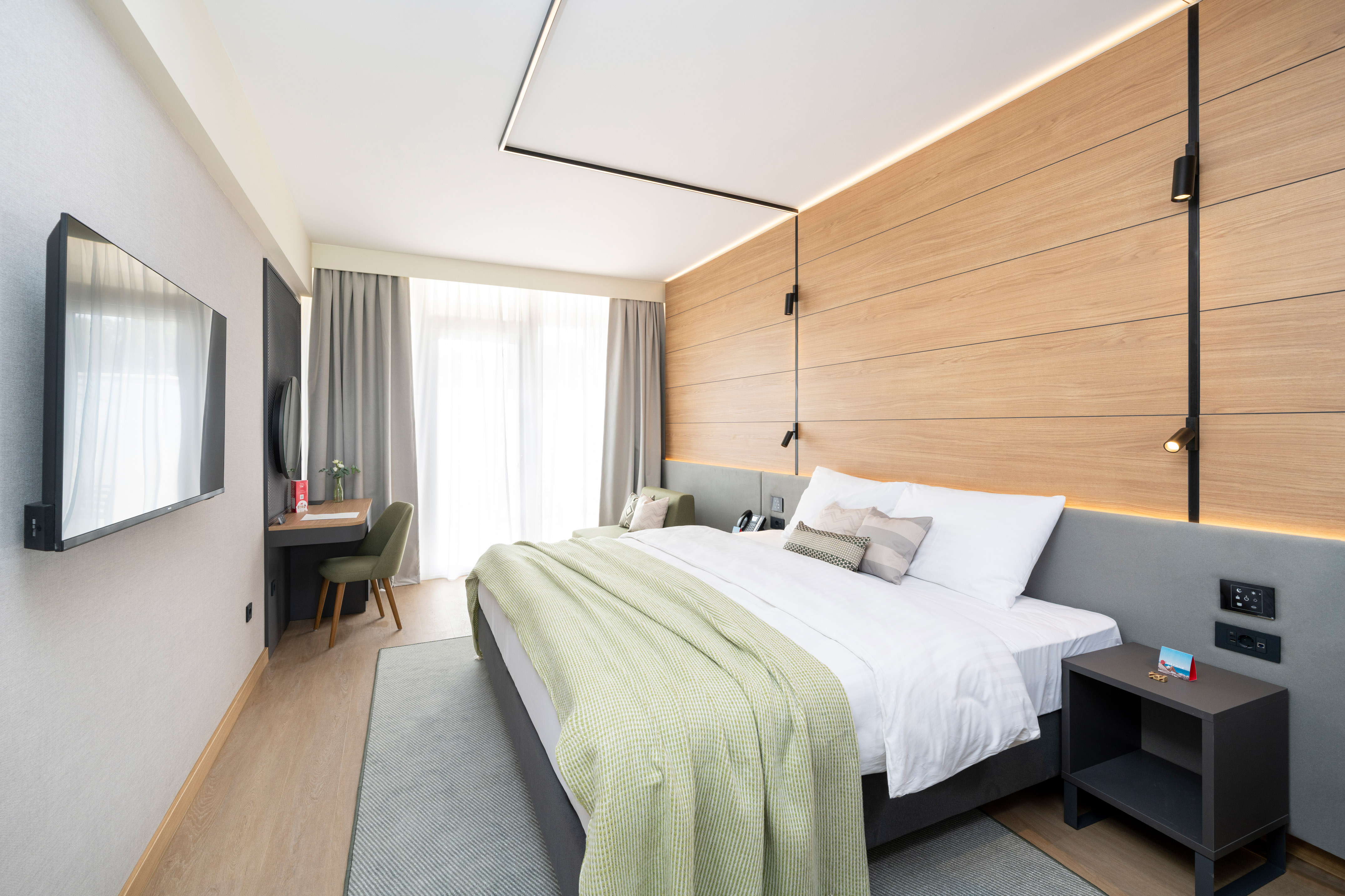 a bedroom with a bed and a desk