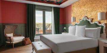 a room with a bed and a chair