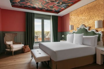 a room with a bed and a chair