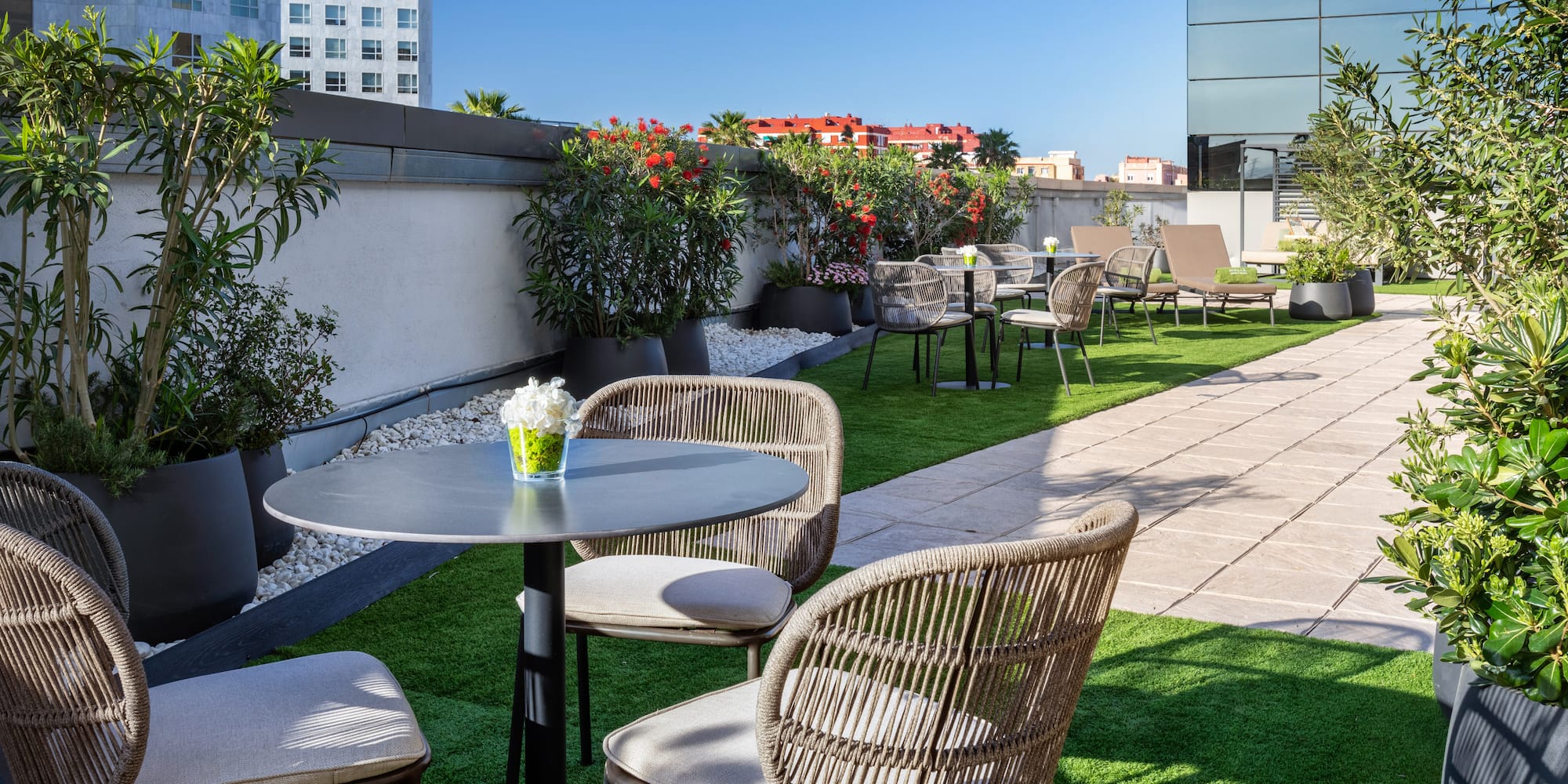 a patio with chairs and tables