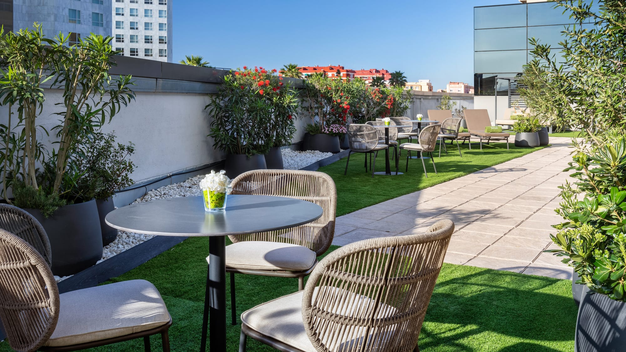 a patio with chairs and tables