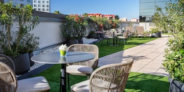 a patio with chairs and tables