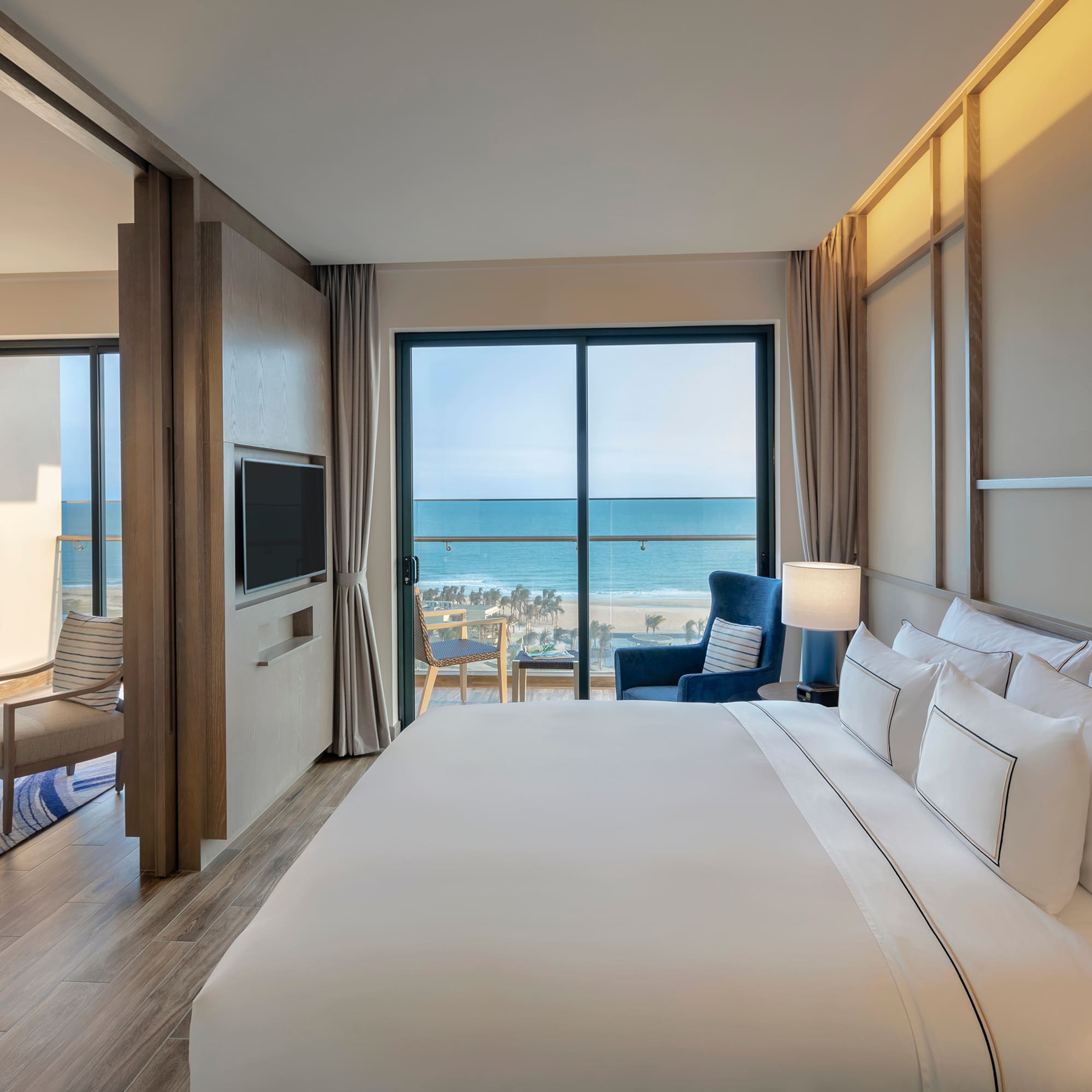 a room with a large bed and a television