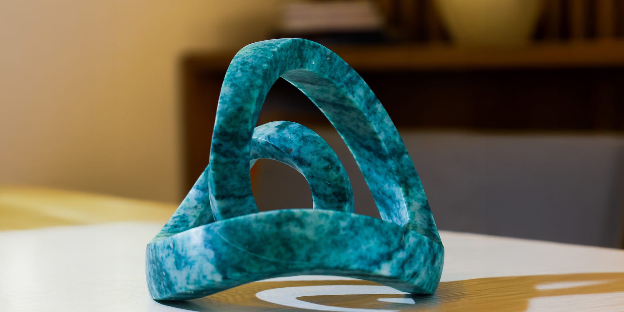 a blue marble sculpture on a white surface