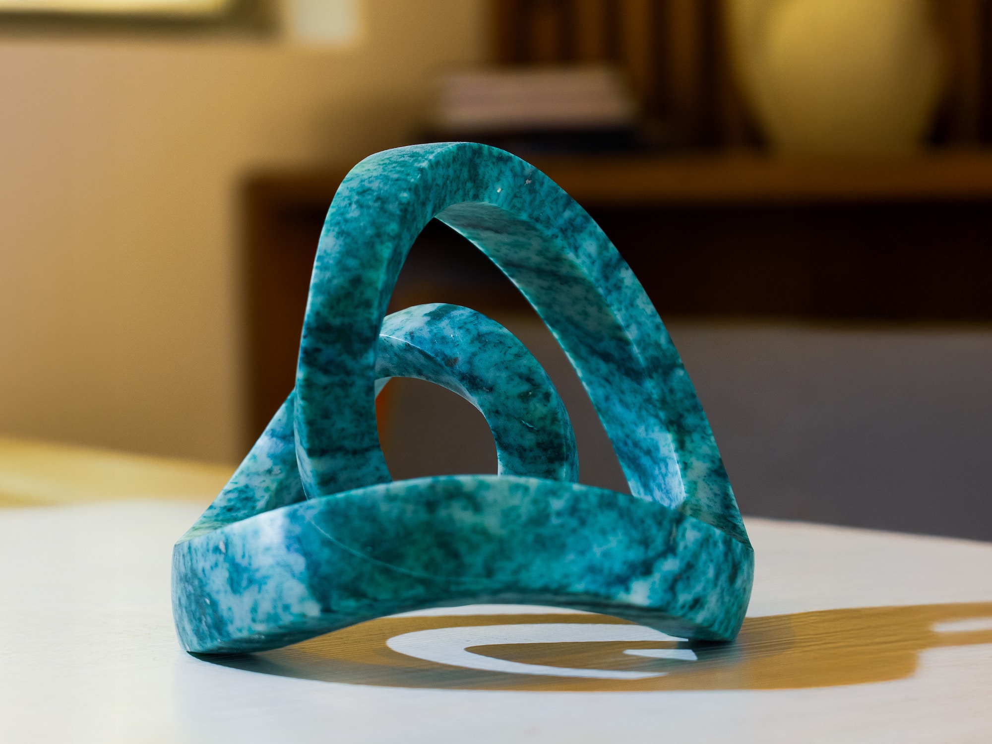 a blue marble sculpture on a white surface