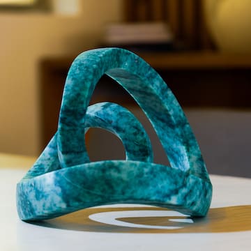 a blue marble sculpture on a white surface