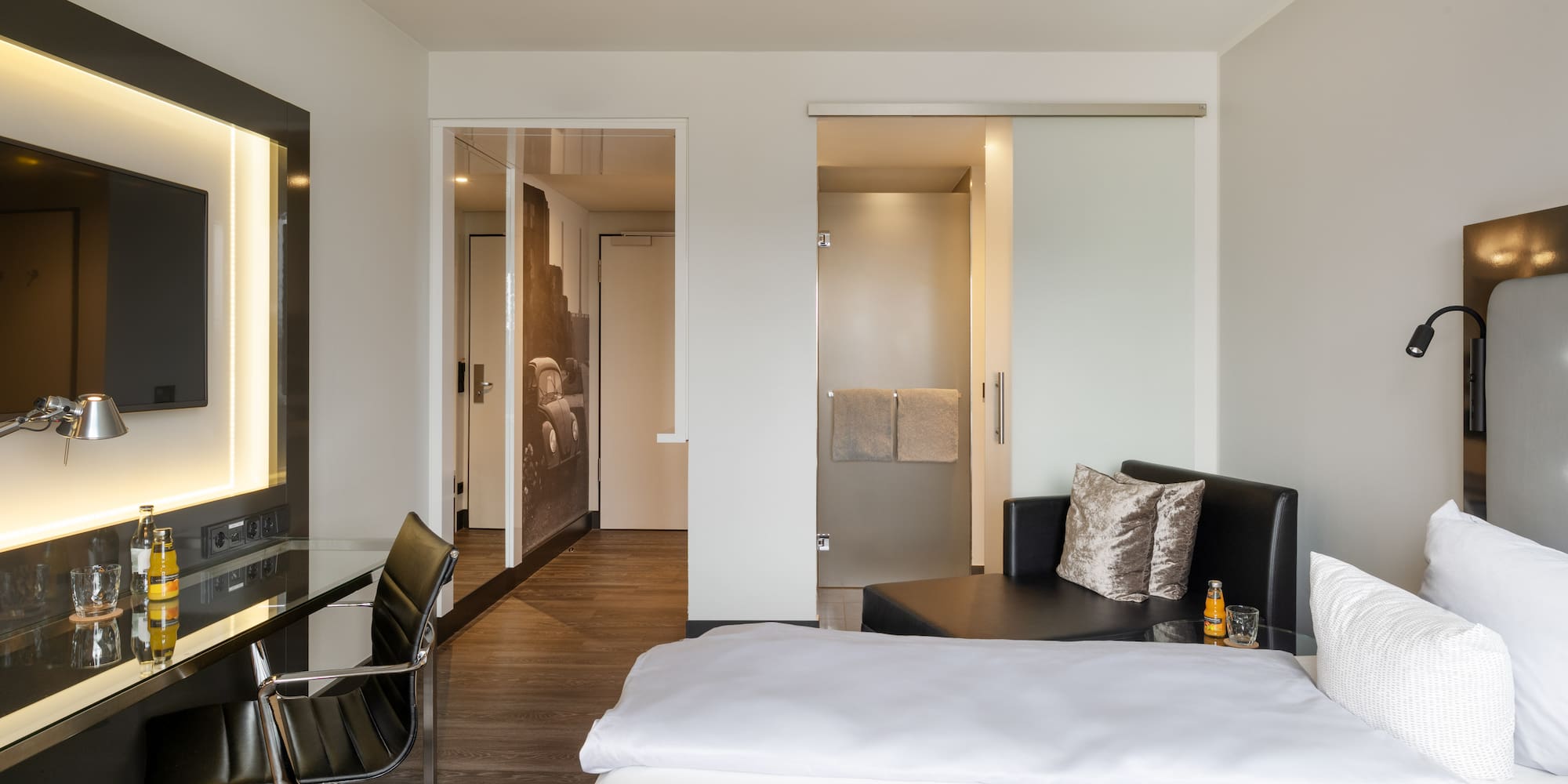 a room with a bed and a desk