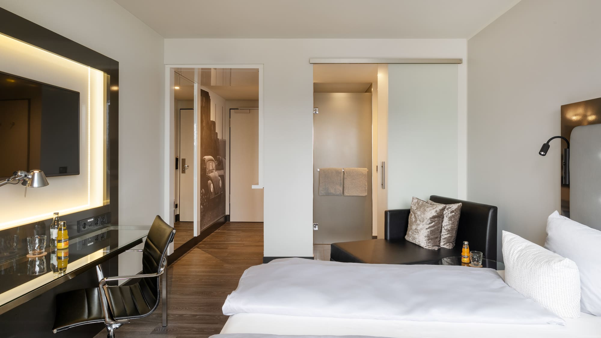 a room with a bed and a desk