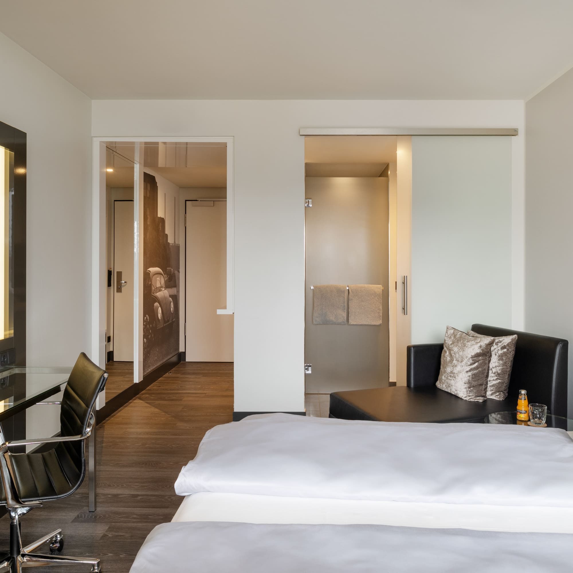 a room with a bed and a desk