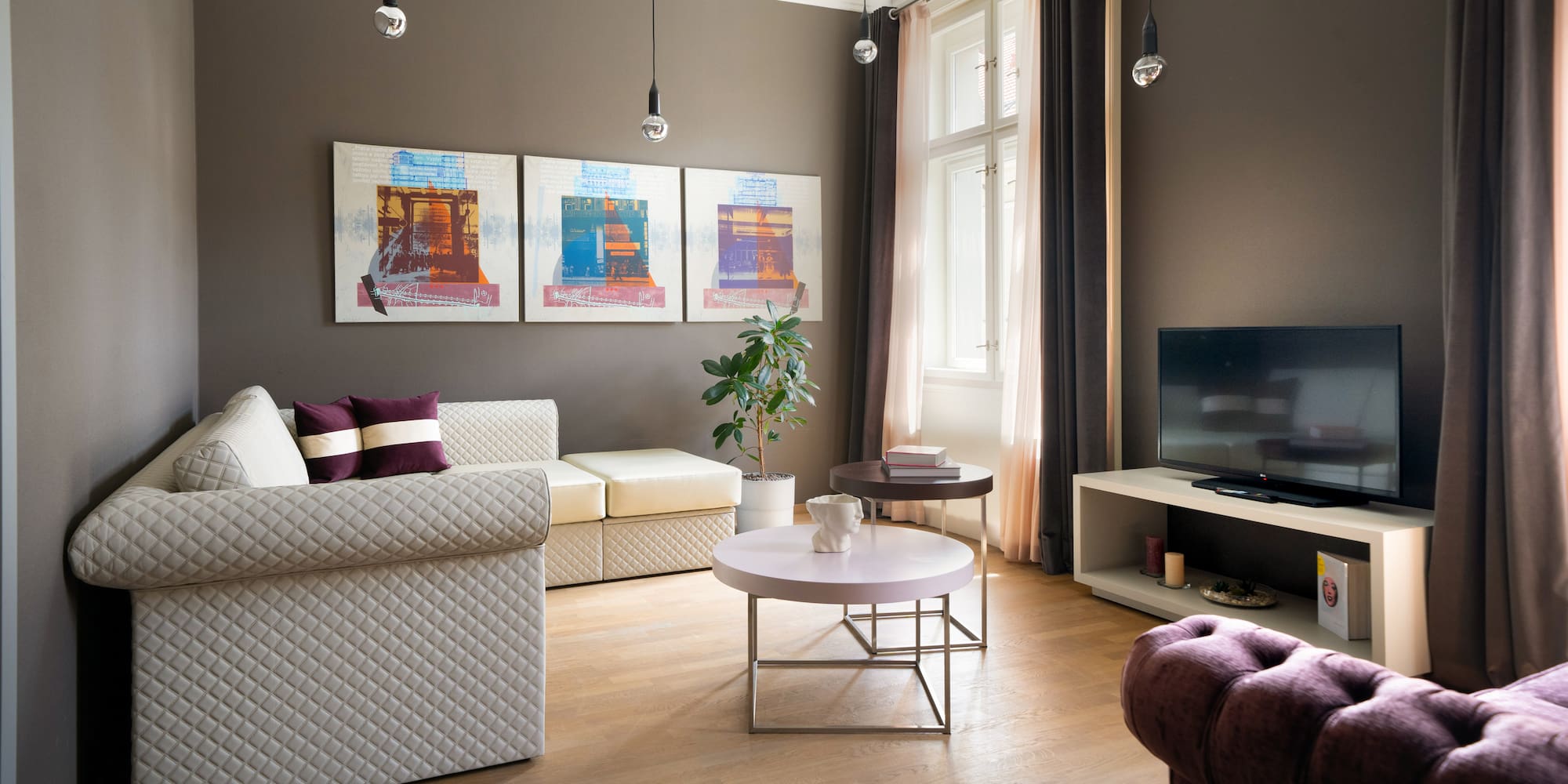 a living room with couches and a tv