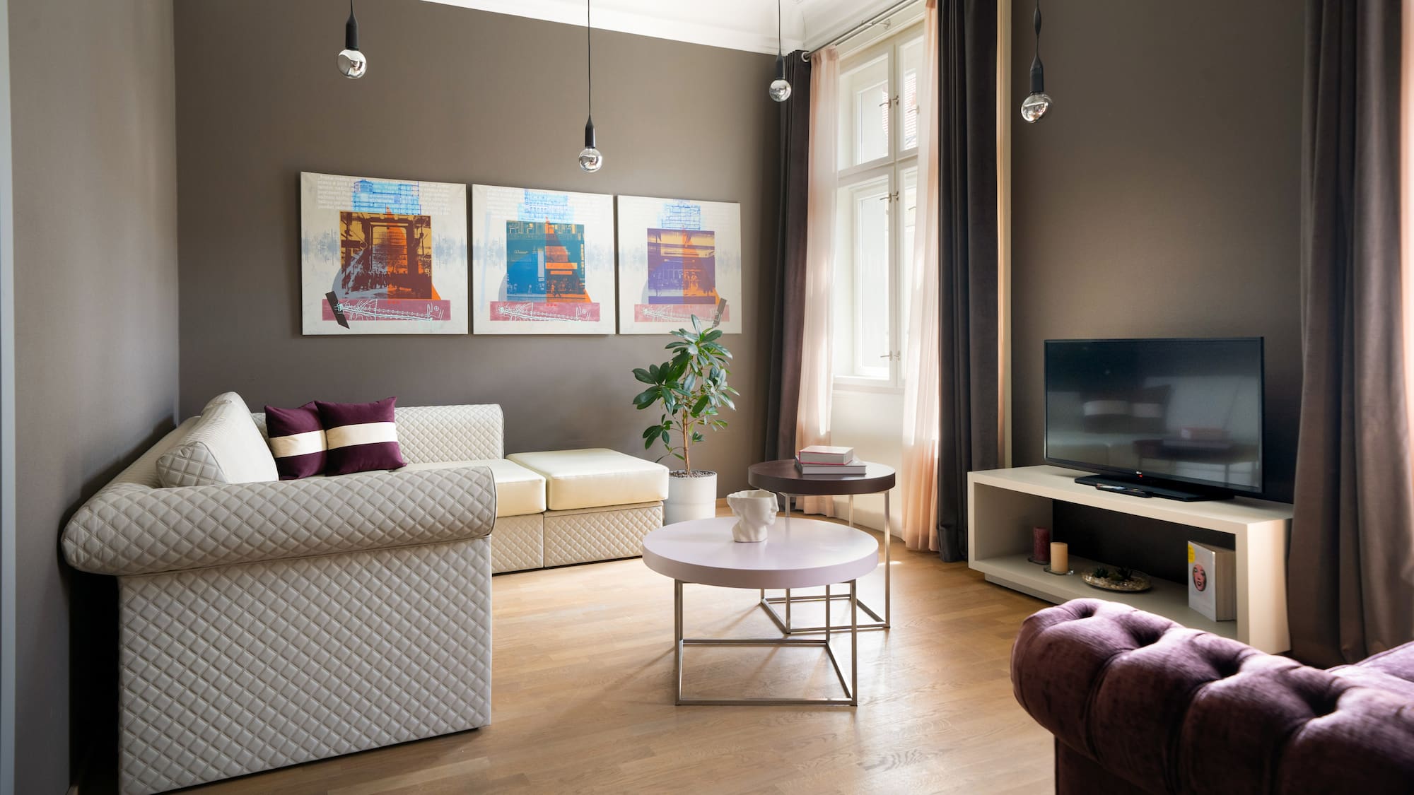 a living room with couches and a tv