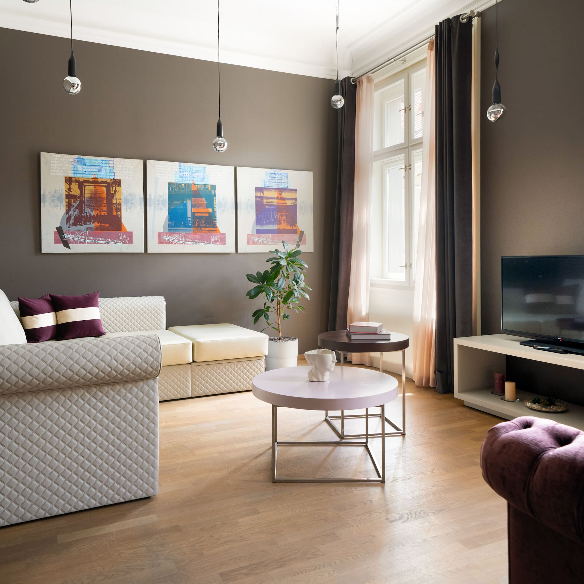 a living room with couches and a tv