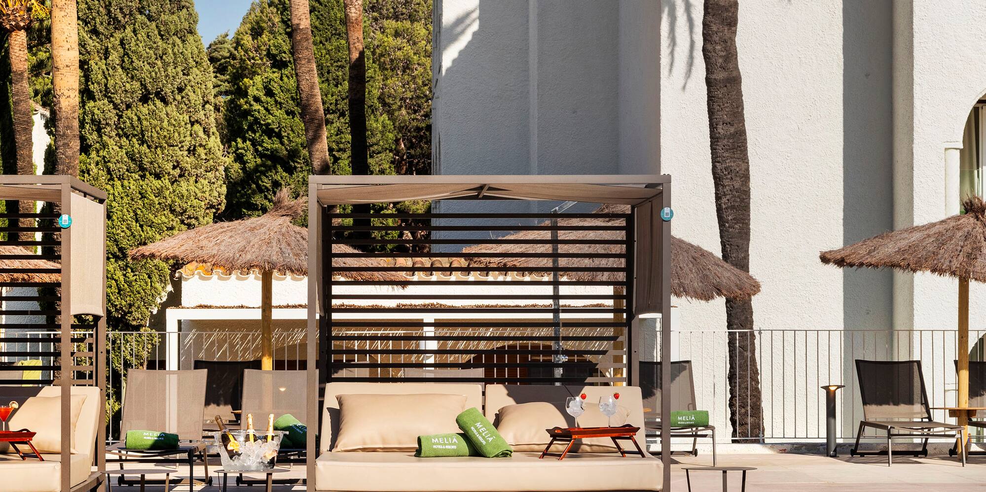 a pool with lounge chairs and umbrellas